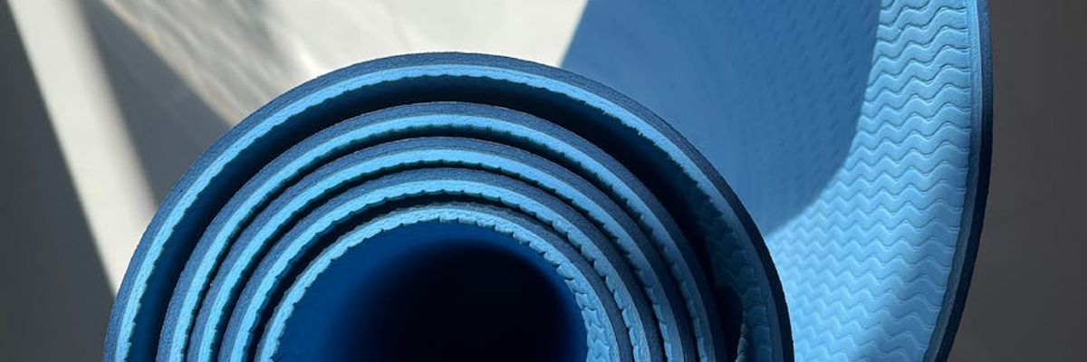 Clean minimalist interior with cold lighting and yoga mat